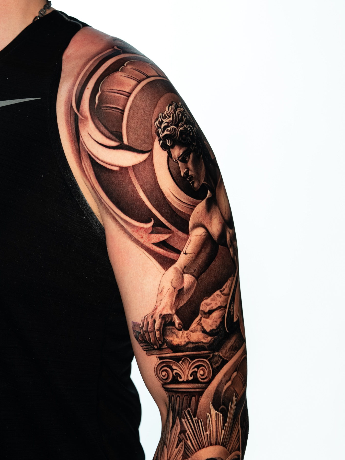 Close-up of sculptural forms and circular architectural details in the Becoming sleeve